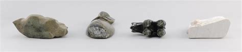 Lot Four Native American Stone Carvings A Colored Marble Bear By Ross