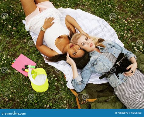 Two Pretty School Girls On Grass Happy Smiling Best Friends Having Fun