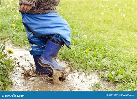 Child In Puddle Stock Image Image Of Splash Spring 31110769
