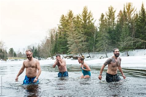 Group Of Friends Swimming In Ice Cold Frozen Winter River Polar Bear