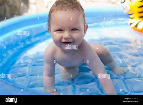 Portrait Of Baby Girl Playing In Swimming Pool Stock Photo Alamy