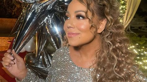 Mariah Carey Dazzles In Plunging Mini Dress Amid 55th Anniversary