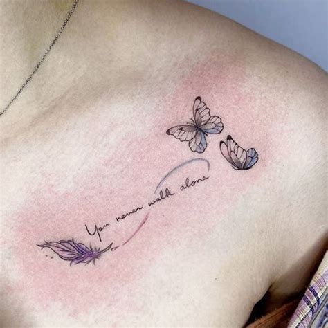 A Woman S Chest With Two Butterflies On It