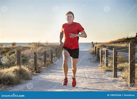 Young Attractive And Happy Sport Runner Man With Fit And Strong Healthy