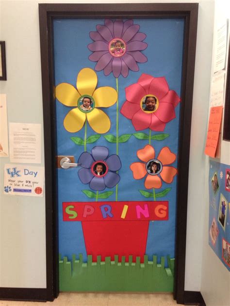 A Door Decorated With Paper Flowers And The Words Spring On It S Front Side