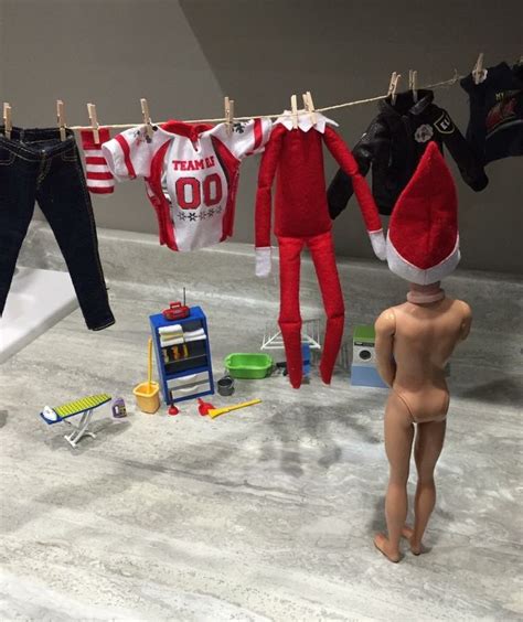 An Elf S Clothes Line With Dolls Toys And Other Items On The Floor