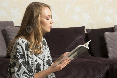 Portarit Of Beautiful Woman Reading A Book In Her Livingroom Photo