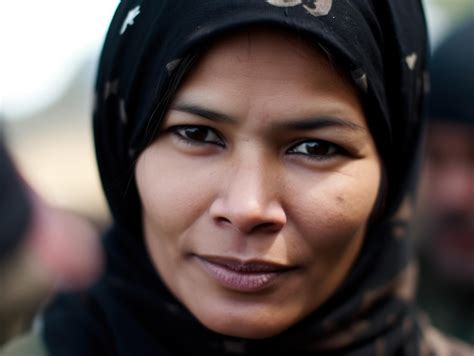 Premium Photo A Woman Wearing A Black Head Scarf