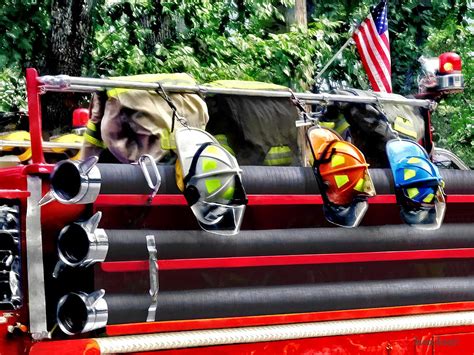 Three Fire Helmets On Fire Truck Photograph By Susan Savad Fine Art