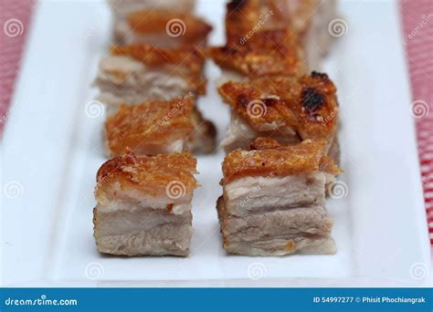 Delicious Roasted Crispy Pork Belly With Three Layers Fats On A Plate