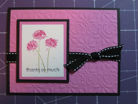 A Card With Pink Flowers And A Black Bow On The Front That Says Thanks