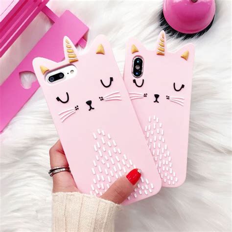 Two Pink Iphone Cases With Cats On Them One Has Gold Horns And The