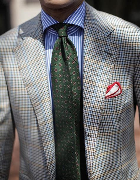 Mix A Plaid Suit With A Stripe Shirt And Accessorize With A Art Deco