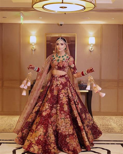 Sabyasachi Bride Wore A Maroon Lehenga Paired It With Unique Emerald