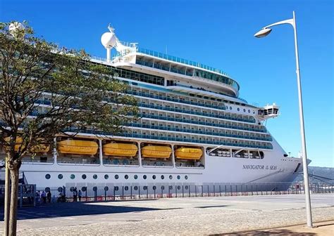 A Large Cruise Ship Docked At The Dock