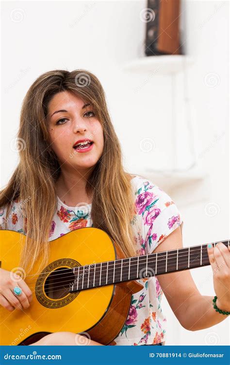 Young Woman or Playing Guitar and Singing Stock Photo - Image of sing ...