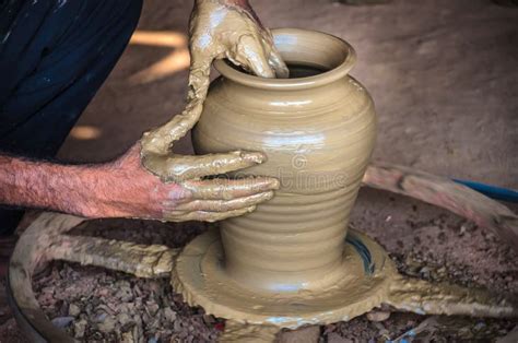 Closeup Of Potter`s Hands Making Clay Water Pot On Pottery Wheel. Stock ...