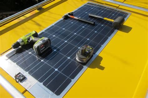 Some Tools Are Laying On Top Of A Solar Panel