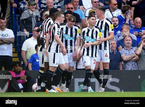 Newcastle United's Anthony Gordon (hidden) celebrates scoring their ...