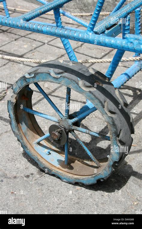 The Rubber Covered Wheel Of A Cart Used To Transport Merchandise In The