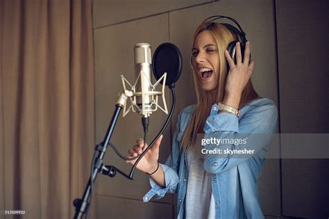 Young Woman Singing In Recording Studio High Res Stock Photo Getty Images