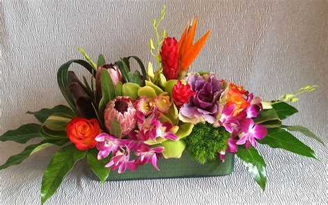 Tropical flower centerpiece | Flower centerpieces, Tropical flowers ...