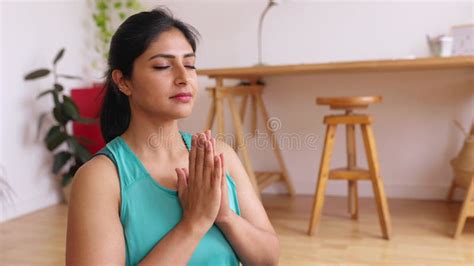 Serene Indian Woman Do Meditation Practice Seated Cross Legged In