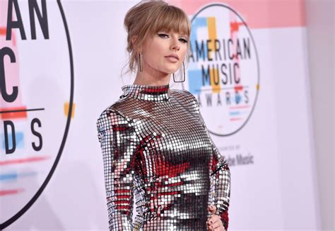 Taylor Swift Looks Like a Disco Ball on the 2018 AMAs Red Carpet