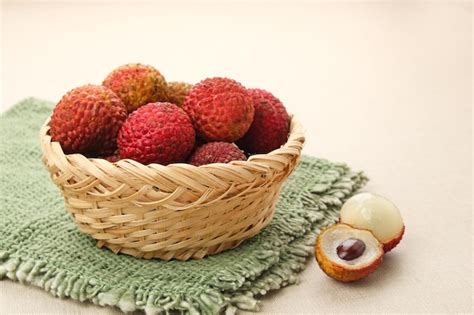 Premium Photo Fresh Ripe Red Lychee Fruit And Peeled Lychee On Bamboo