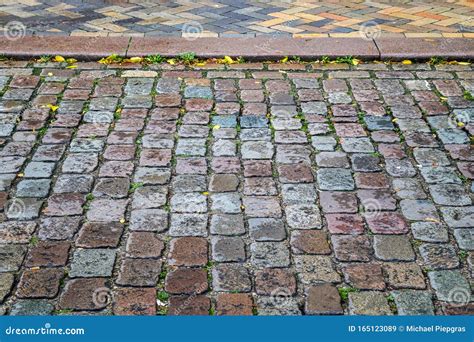 Detailed Close Up View On Cobblestone Streets And Sidewalks In High