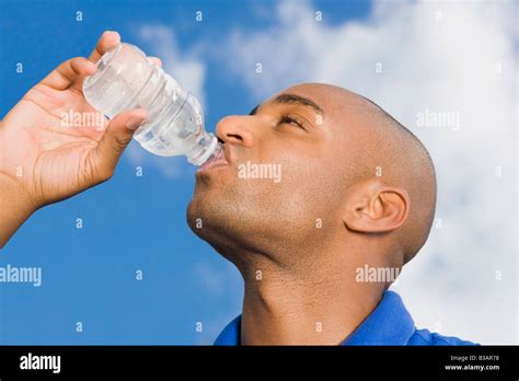 African Man Drinking Water Stock Photo Alamy