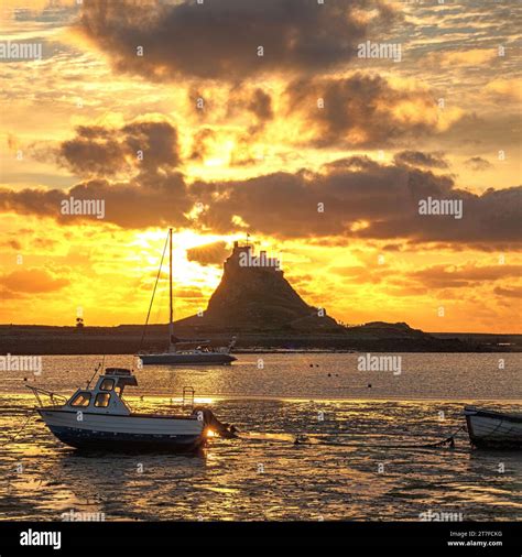 Sunrise In Summer Over Lindisfarne Castle On The Holy Island Of