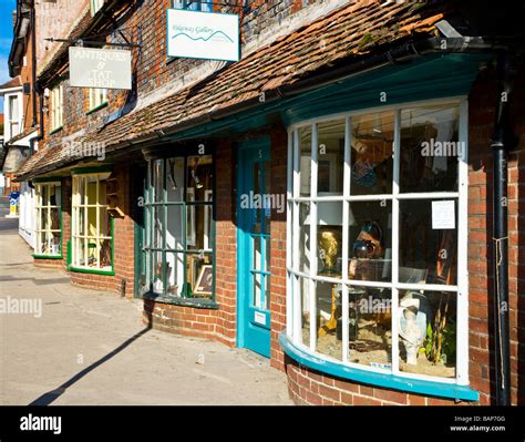 A Row Of Quaint Old Bow Fronted Shops In The Typical English Market