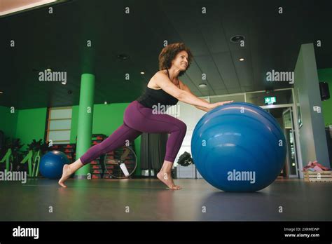 Portrait Of Mature Year Old Woman Traing With Fitness Ball At Gym Healthy Lifestyle