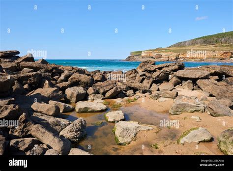 Steep Cliffs With A Deep Blue Sea And A Clear Blue Sky Stock Photo Alamy