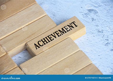 Top View Of Achievement Text On Wooden Blocks Business Culture And