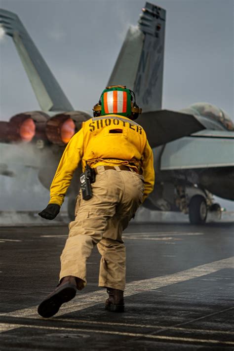 U S Navy Sailor Launches F A 18f Super Hornet From Uss Nimitz