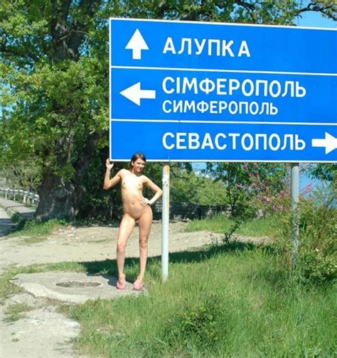 Naked Girl At A Road Sign