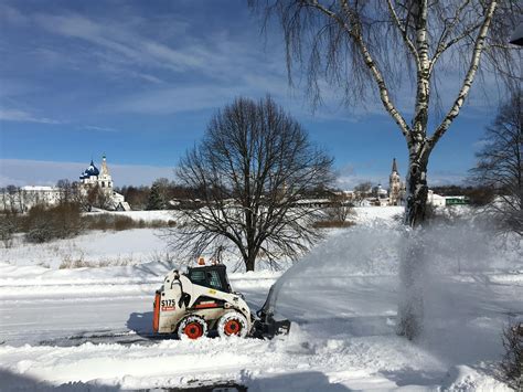 Snow cutter cleaning snowy road in countryside · Free Stock Photo