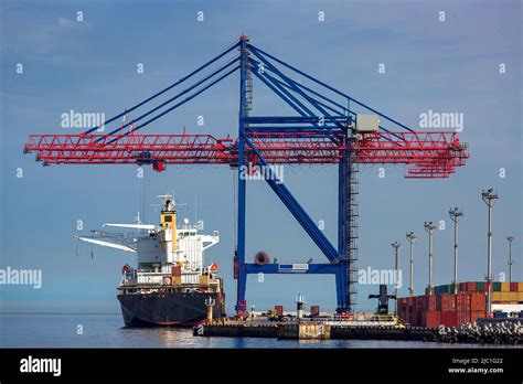 cargo ship moored   berth   container ship yard  loading