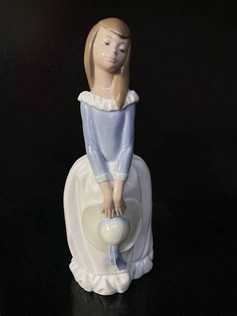 Nao By Lladro Daisa Figurine Girl Holding A Hat Dressed In Long