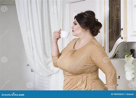 Plus Size Fashion Model On Kitchen Fat Woman On Luxury Interior Overweight Female Body Stock