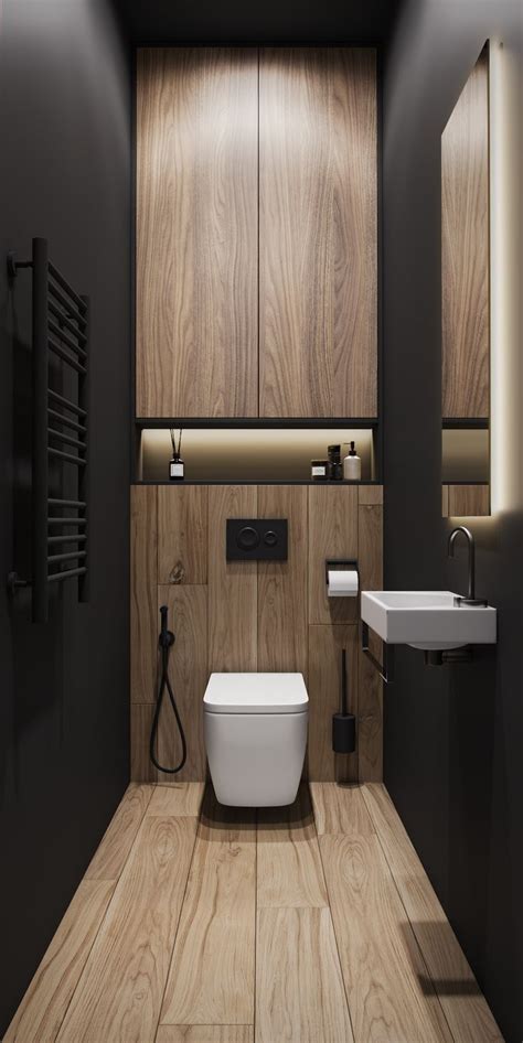 A Modern Bathroom With Wood Paneling And White Fixtures Including A