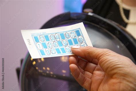 Foto De Person Playing Bingo Womans Hands Holding Cardboard From