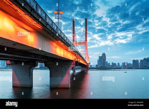 Modern bridge in the city at night Stock Photo - Alamy