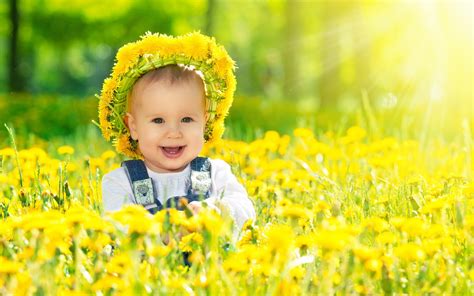 Happy Baby Girl With Yellow Flowers Wallpapers 2560x1600 692779