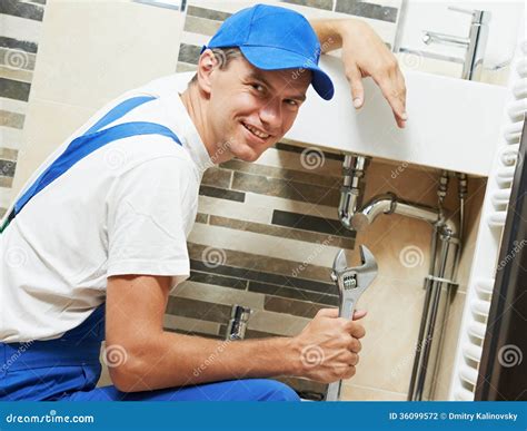 Young Smiling Plumber Man Worker Stock Photo Image Of Lavatory Happy