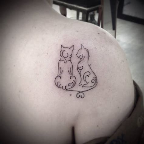 Shoulder Blade Tattoo Of Two Cats In Love