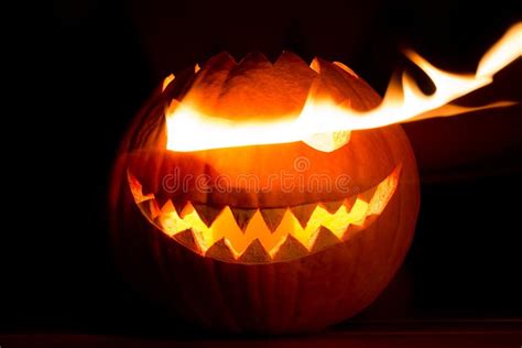 Spooky Carved Halloween Pumpkin In Hot Burning Hell Fire Flames Stock