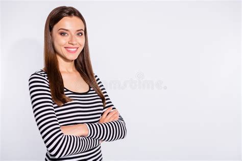 Turned Portrait Of Lovely Woman Crossing Her Hands Looking At Camera